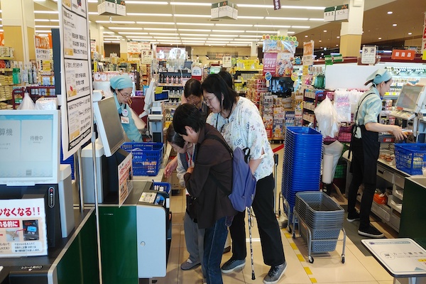 People shop at a grocery store.