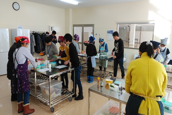People work at a cooking class.