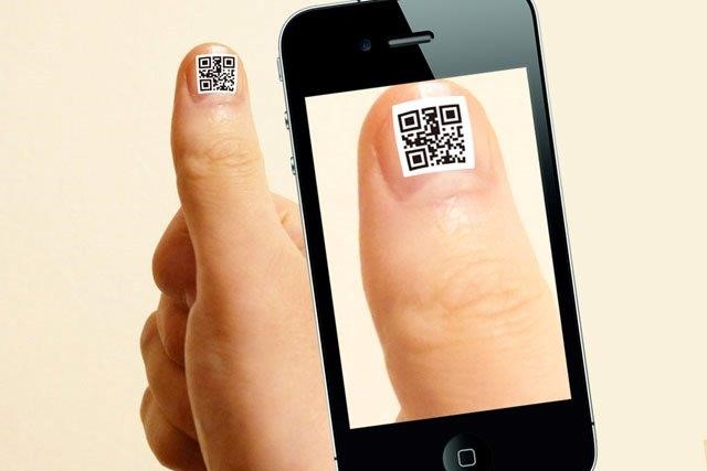A simulated photo of someone scanning another's Orange Link QR Code.