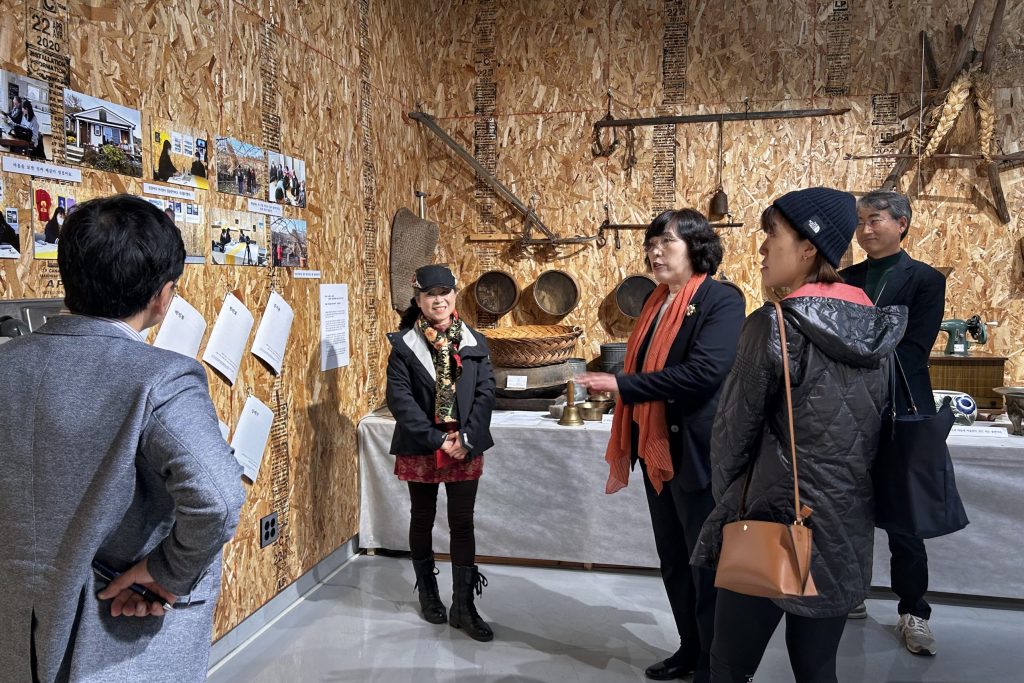 A local resident explains the exhibits inspired by local sights and sounds